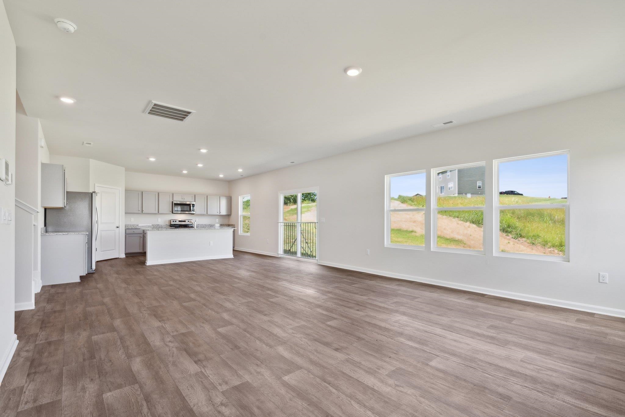 4520 Christopher Place Penn Laird, VA 22846 - Photo 3 of 22 a view of a kitchen with wooden floor and a window