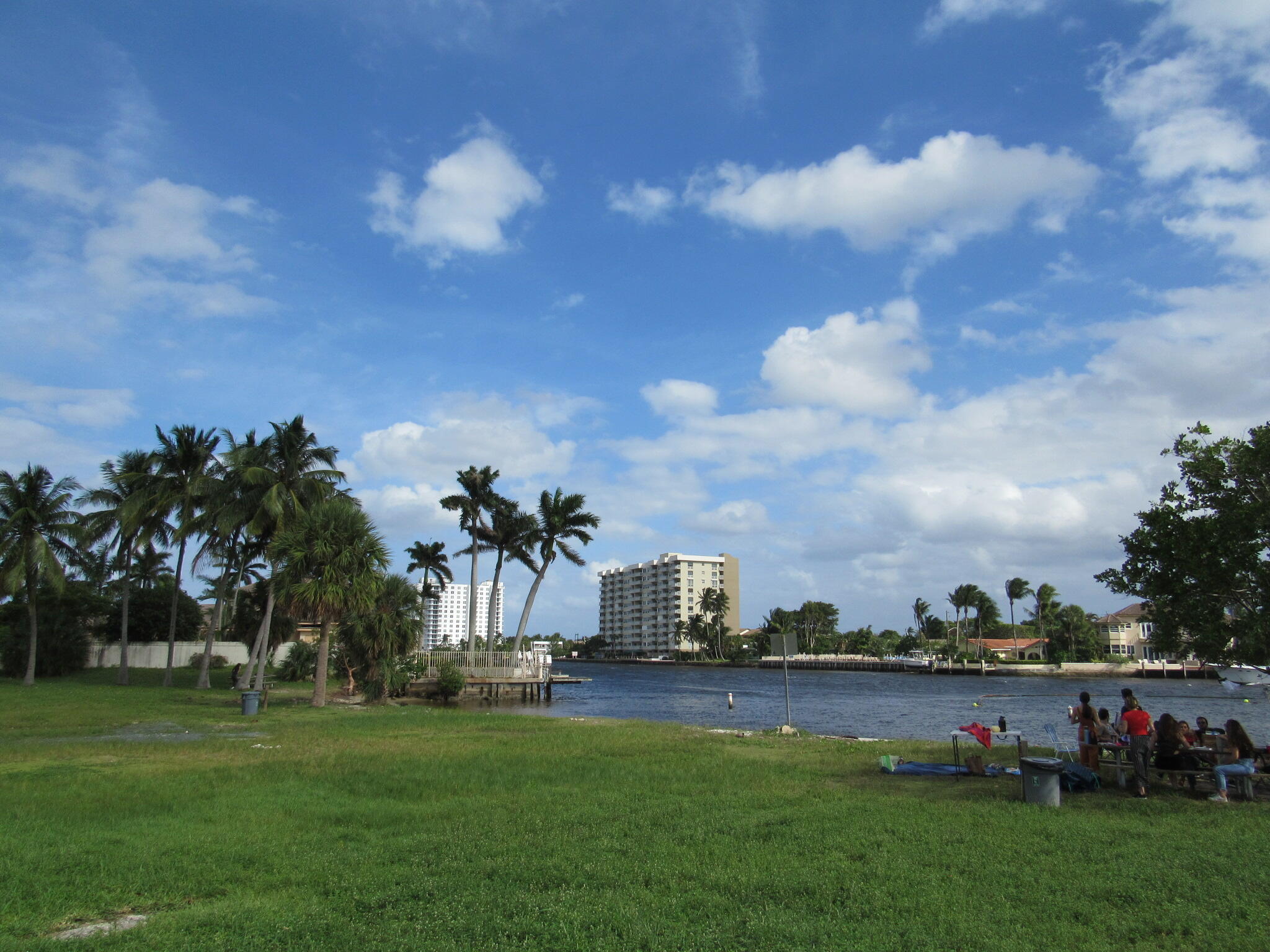 1911 Northeast 27th Court, Unit 13 Lighthouse Point, FL 33064 - Photo 57 of 61 a view of a lake with a big yard