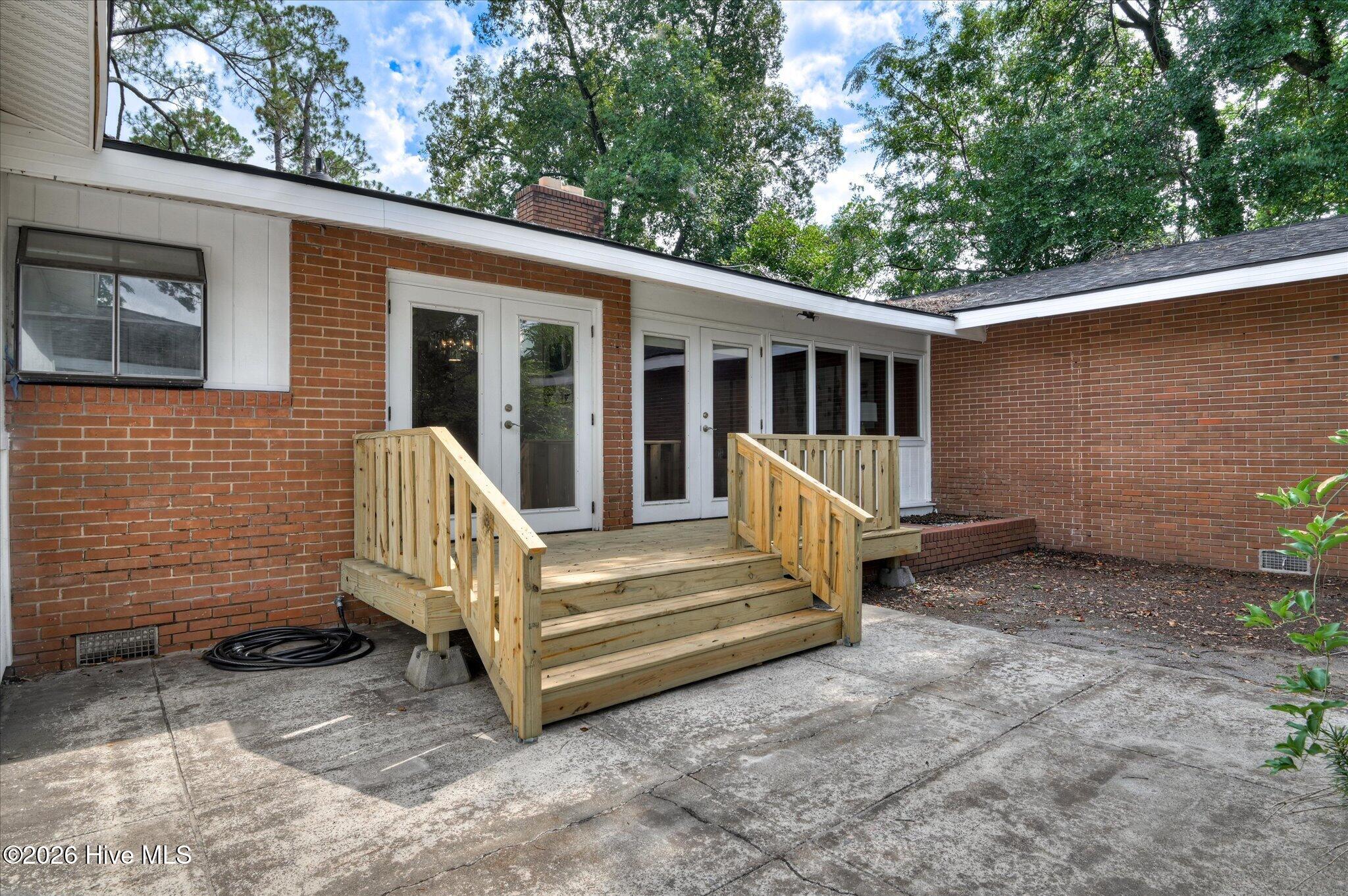 3033 Pine Needle Road Augusta, GA 30909 - Photo 38 of 40 Rear of home with original planter and patio area