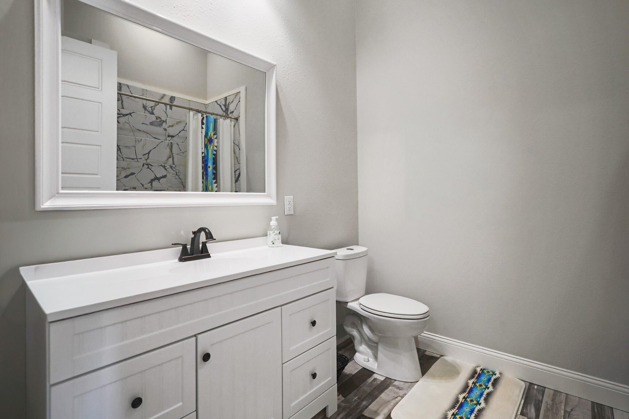 301 Fagan Road Snyder, TX 79549 - Photo 69 of 102 a bathroom with a toilet a sink and a mirror