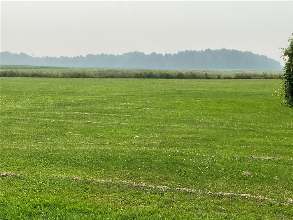 13576 Ridge Road West Gaines, NY 14411 - Photo 6 of 23 large back yard with open fields behind.
