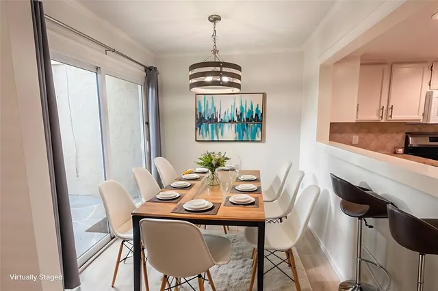 a dining room with furniture and window