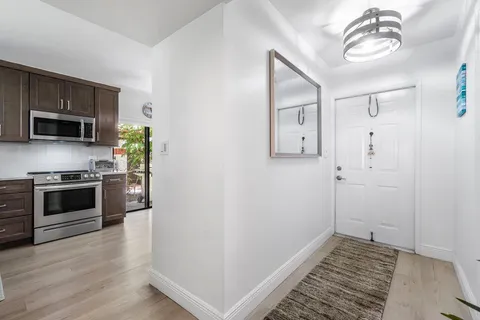 a kitchen with a stove and a microwave