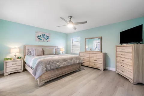 a bedroom with a bed and a television