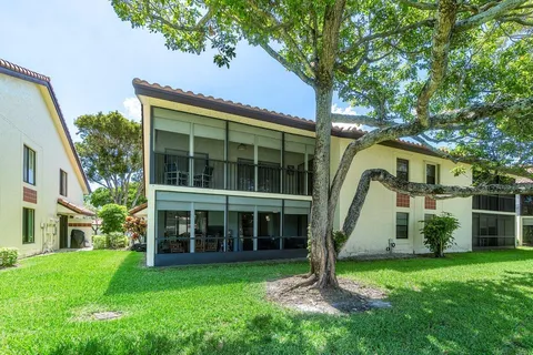 a view of house with yard and entertaining space