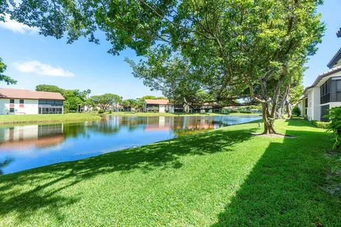 a view of a lake with a house in the background