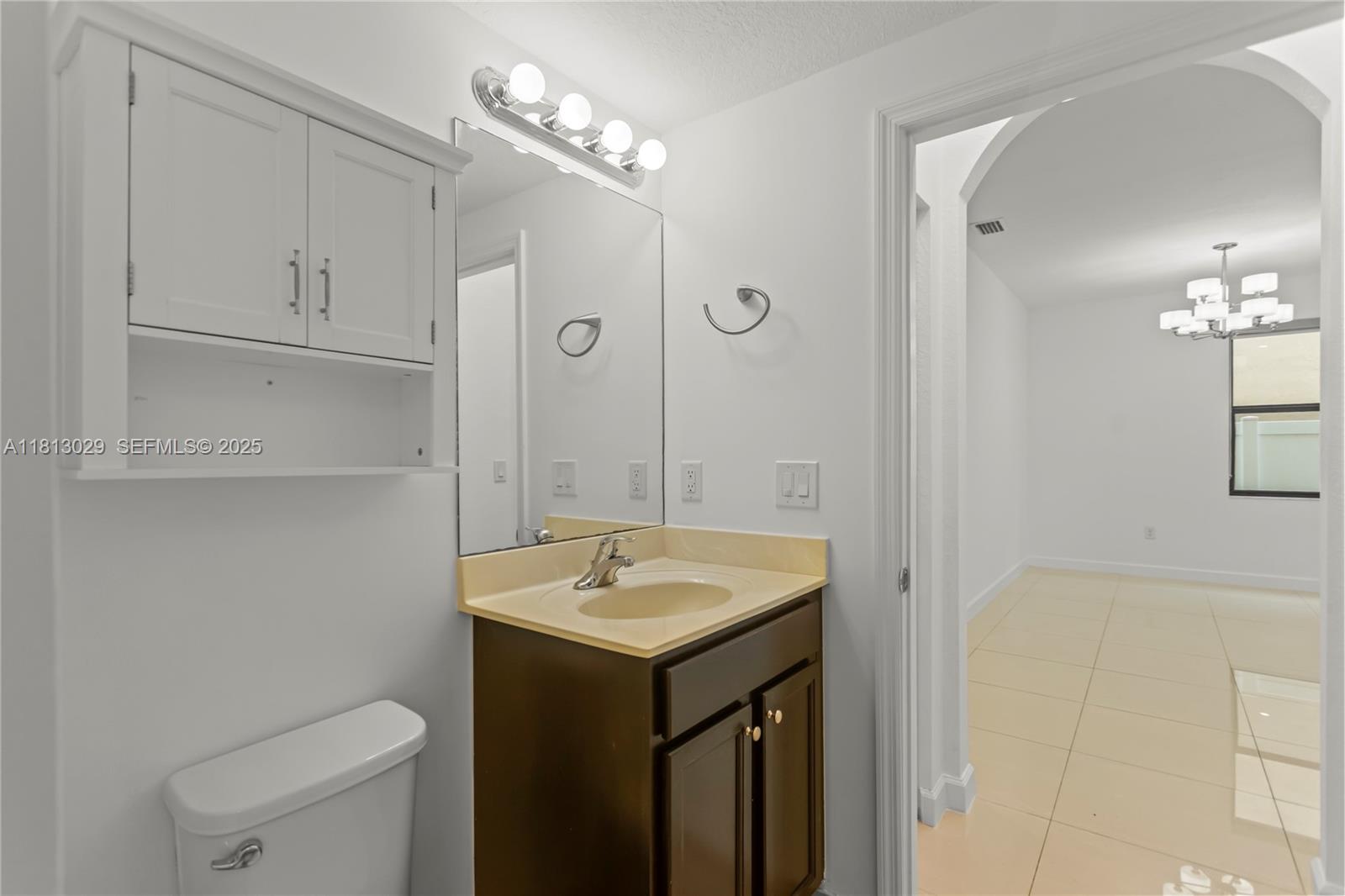 3502 West 86th Terrace Hialeah, FL 33018 - Photo 26 of 68 a bathroom with a sink a toilet and shower