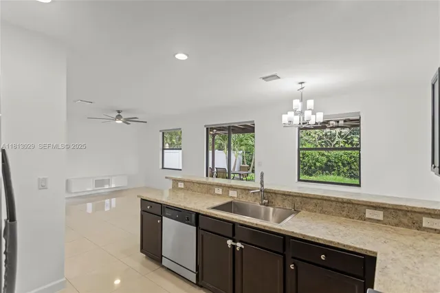 a kitchen with a sink stove and microwave
