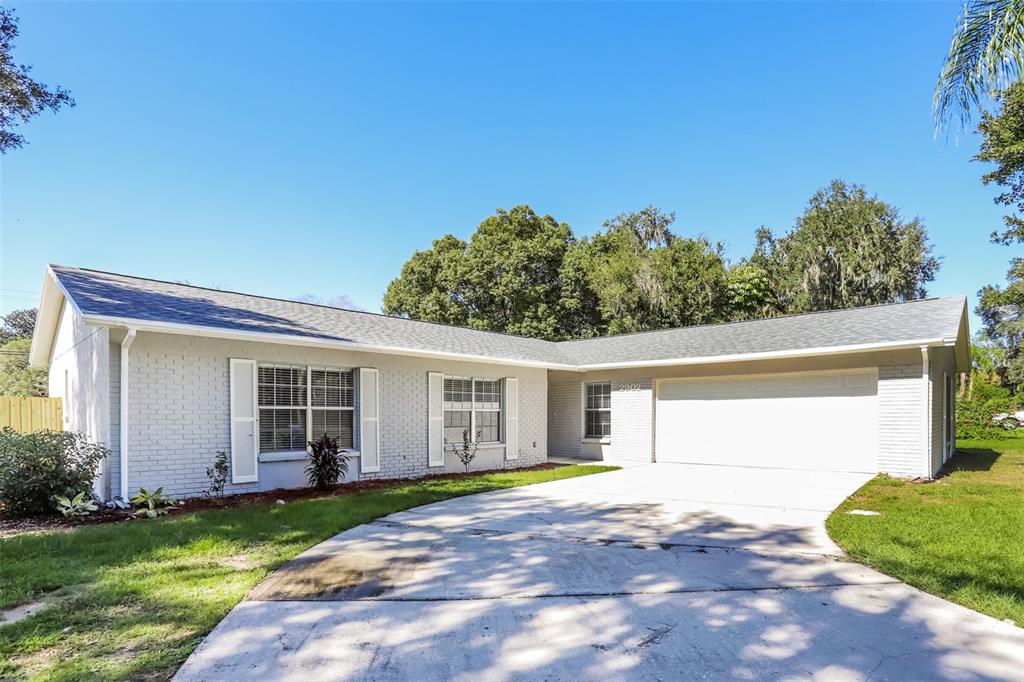 2902 Forest Circle Seffner, FL 33584 - Photo 1 of 1 a view of a backyard with plants and large trees
