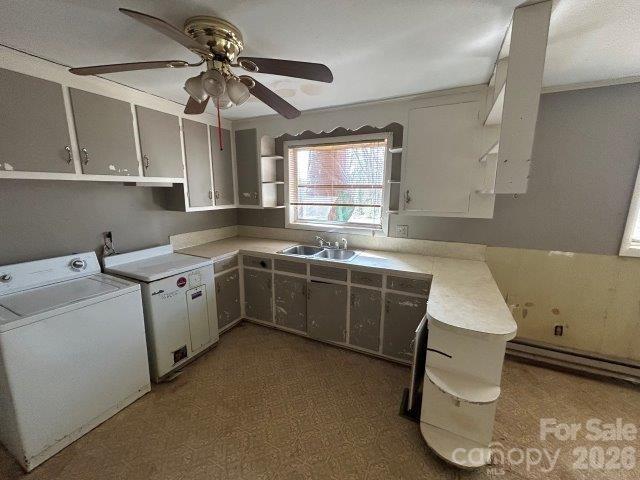 918 Emmanuel Church Road Conover, NC 28613 - Photo 2 of 17 a kitchen that has a sink a stove and a table in it