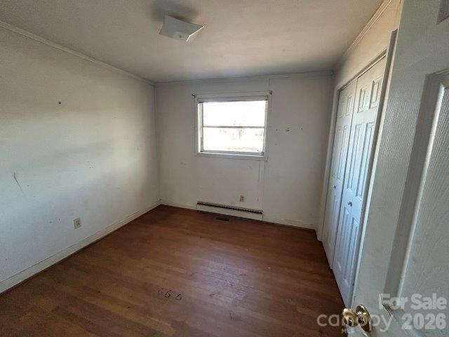 918 Emmanuel Church Road Conover, NC 28613 - Photo 7 of 17 an empty room with wooden floor and windows