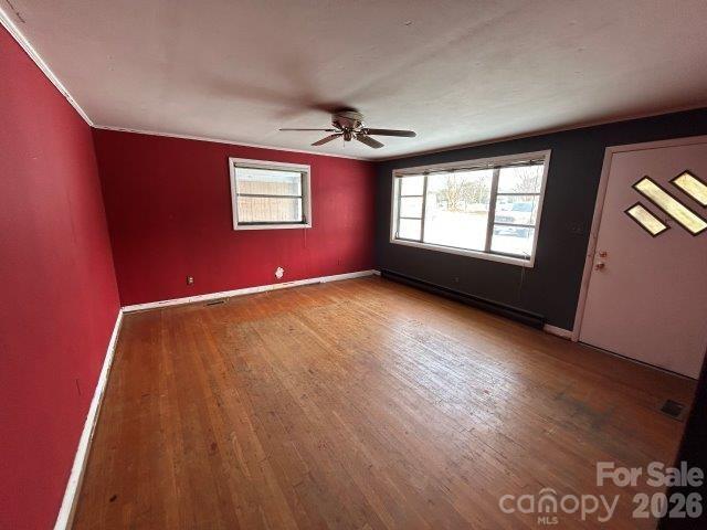 918 Emmanuel Church Road Conover, NC 28613 - Photo 9 of 17 wooden floor in an empty room with a window