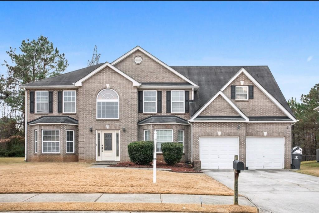 6298 Shell Drive Southwest Atlanta, GA 30331 - Photo 1 of 1 a front view of a house with garage