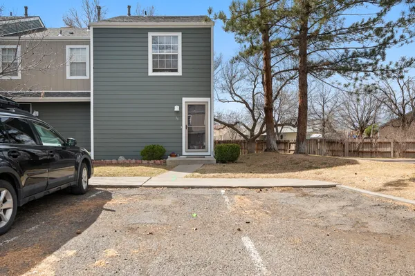 a view of a car parked in front of a house