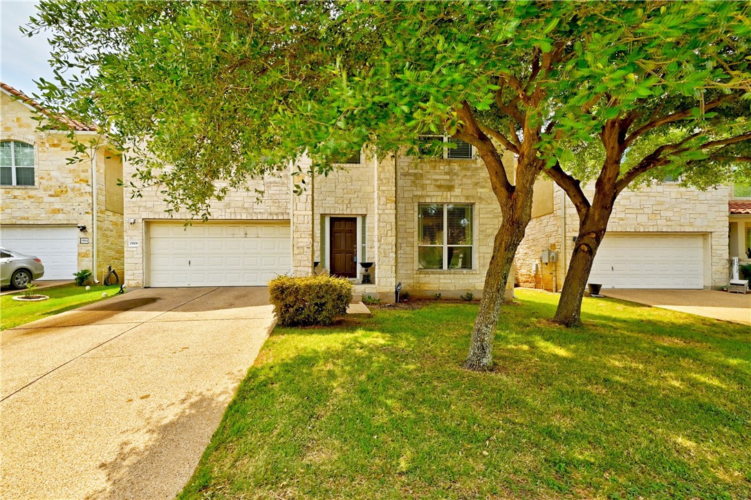 a house that has a tree in front of it
