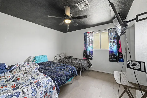 a bedroom with bed and a window