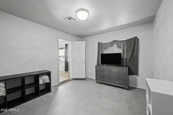 a view of an empty room and fire place