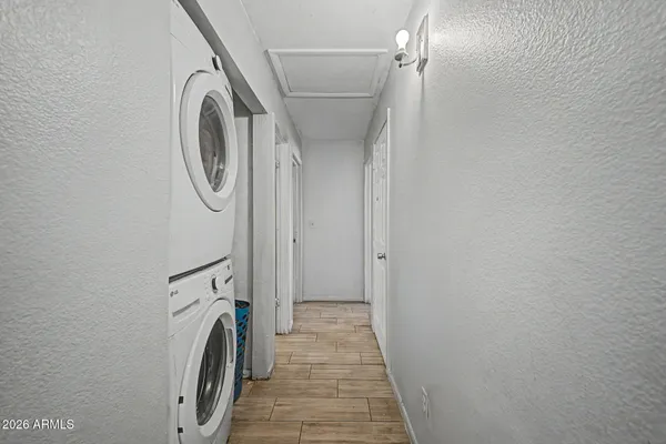 a view of a storage & utility room with a washer dryer