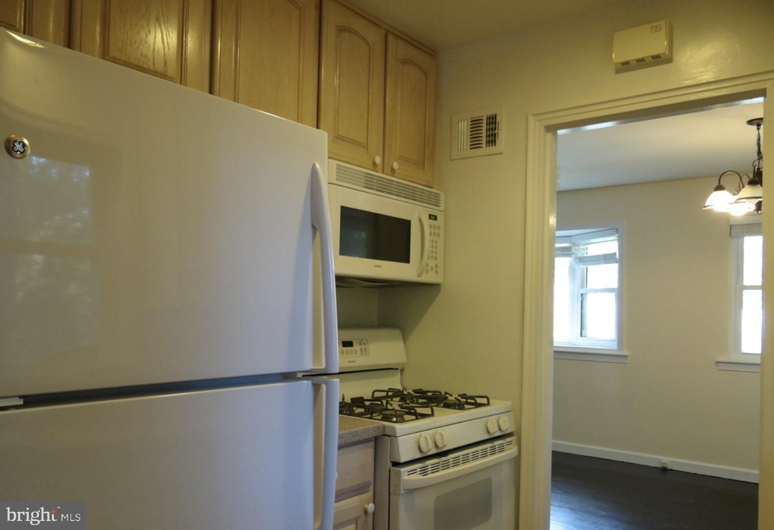121 Whitmoor Terrace Silver Spring, MD 20901 - Photo 2 of 11 a kitchen with stainless steel appliances a refrigerator and a stove top oven