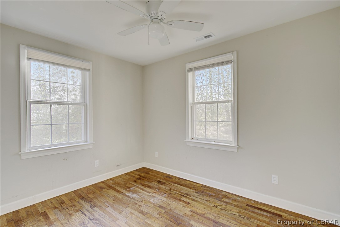 5347 Ware Neck Road Gloucester, VA 23061 - Photo 11 of 36 Spare room with ceiling fan and light hardwood / wood-style floors