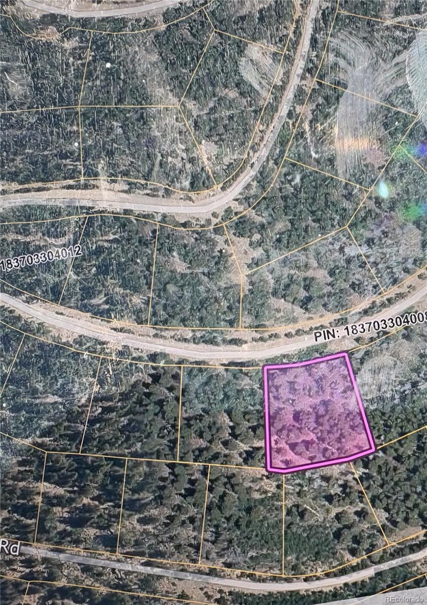 491 Hilltop Road Idaho Springs, CO 80452 - Photo 2 of 19 a sign that is on the side of a road