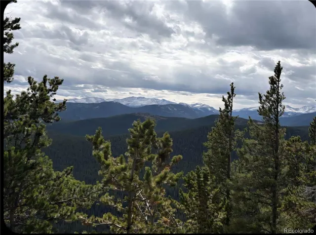 an aerial view of a houses with yard