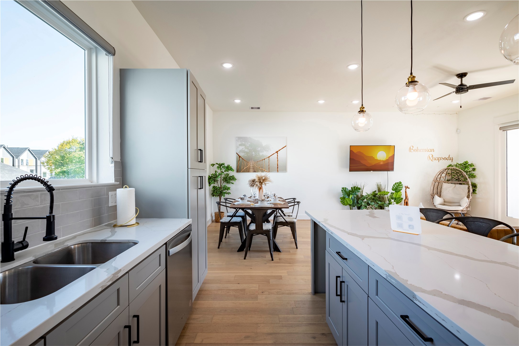 2721 Rosalie Street Houston, TX 77004 - Photo 11 of 44 a kitchen with kitchen island granite countertop a sink a counter top space and living room view