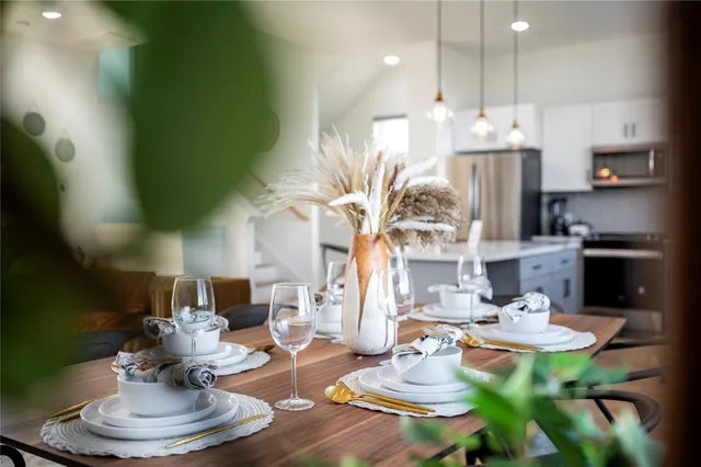 a view of a dining room with furniture and window
