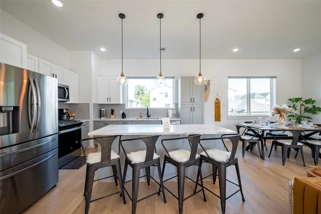 a kitchen with a table and chairs in it