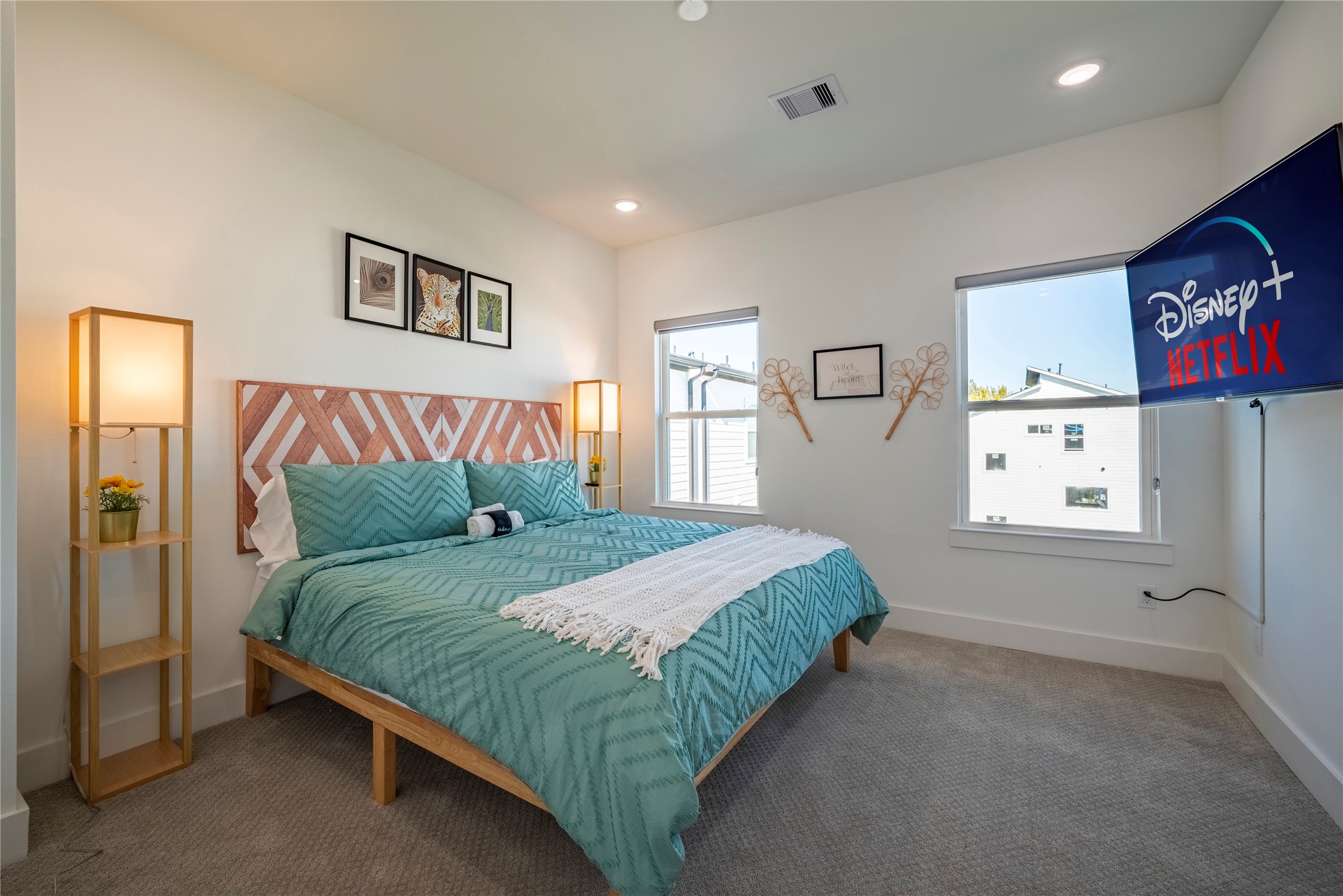 2721 Rosalie Street Houston, TX 77004 - Photo 29 of 44 a bedroom with a bed and painting on the wall