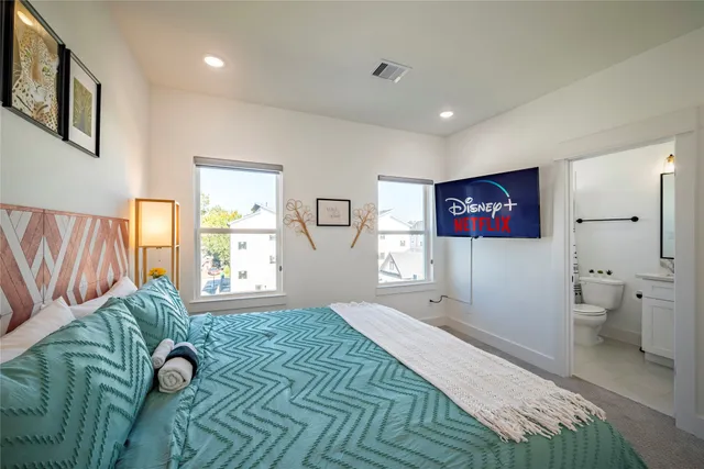 a bedroom with a bed and a table