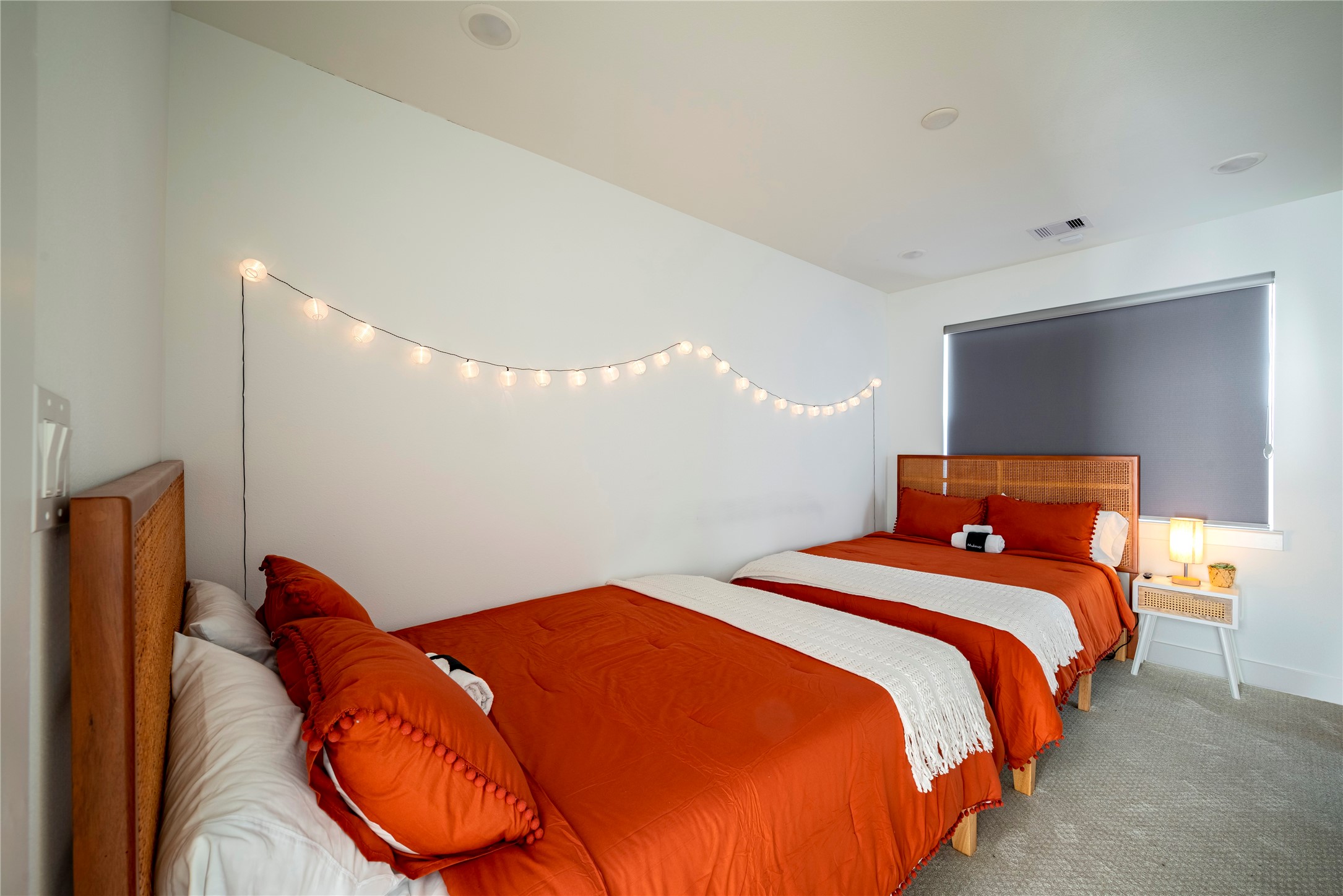 2721 Rosalie Street Houston, TX 77004 - Photo 32 of 44 a bedroom with bed and a potted plant