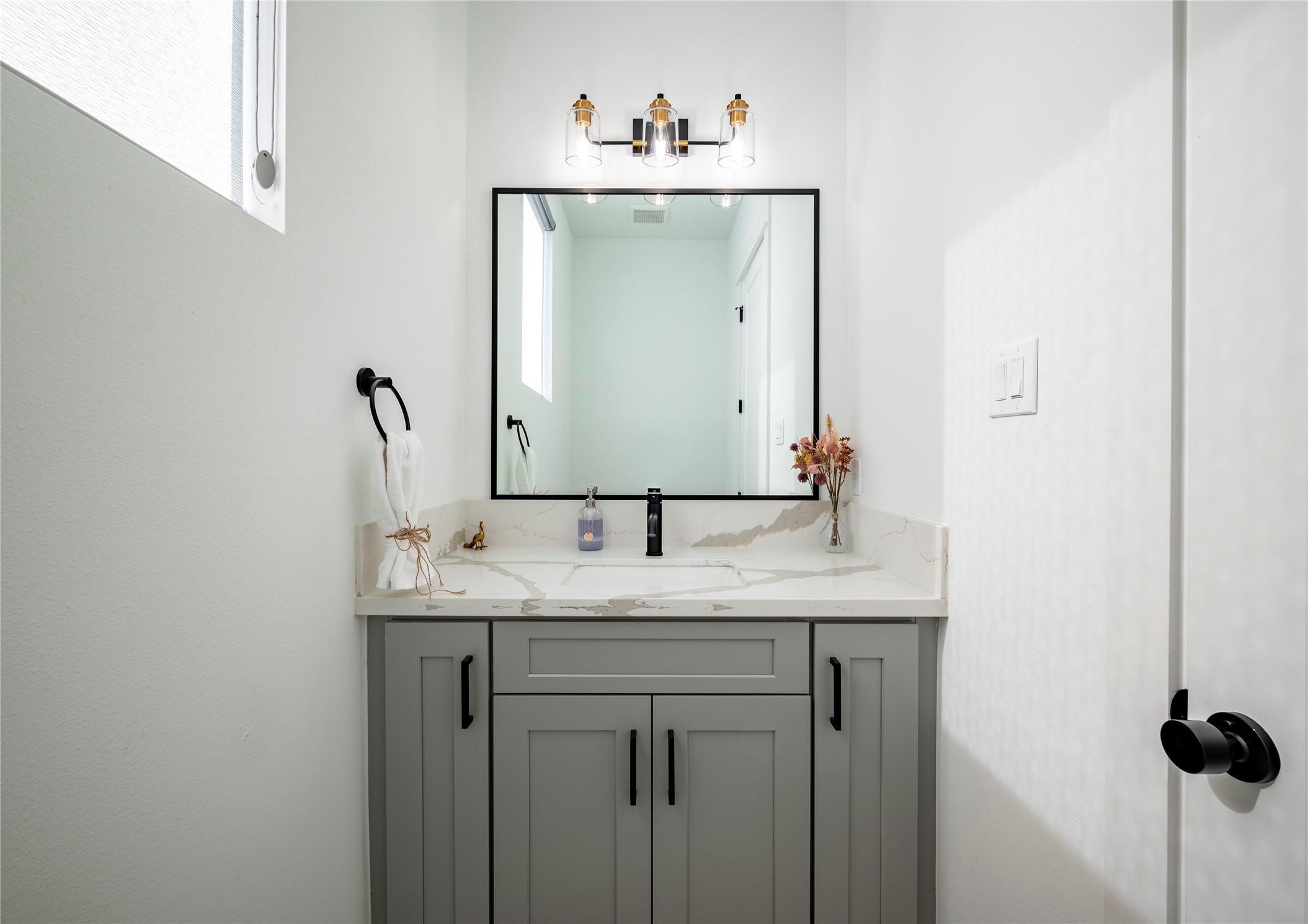 2721 Rosalie Street Houston, TX 77004 - Photo 37 of 44 a bathroom with a granite countertop sink and a mirror