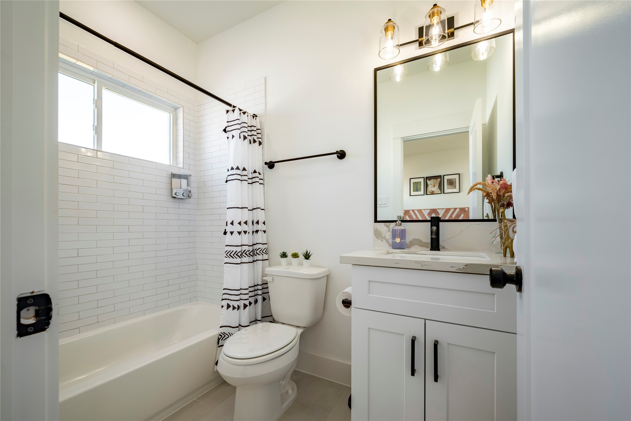 2721 Rosalie Street Houston, TX 77004 - Photo 38 of 44 a bathroom with a sink a toilet a mirror and shower