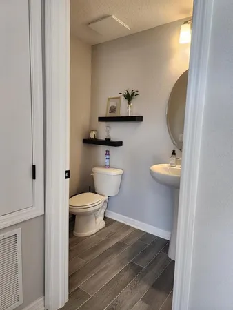 a bathroom with a toilet and a sink