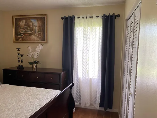 a room with window and furniture