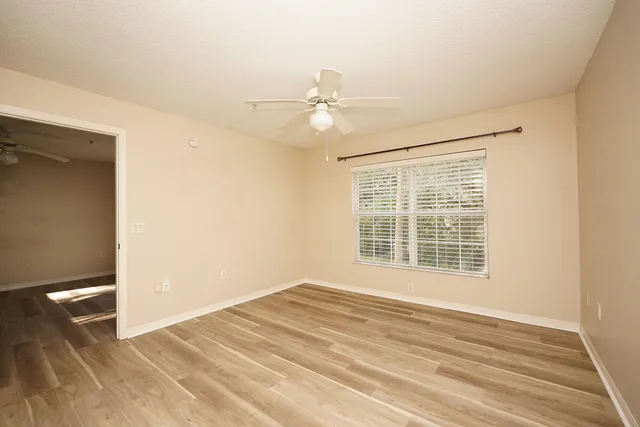 a view of an empty room with a window