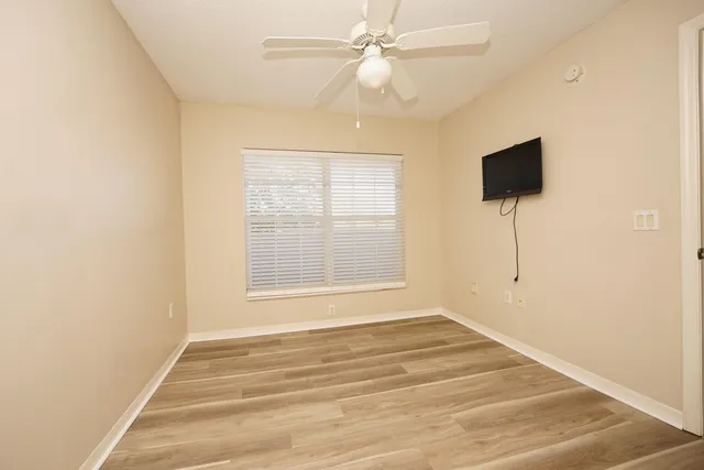 a view of an empty room with a window