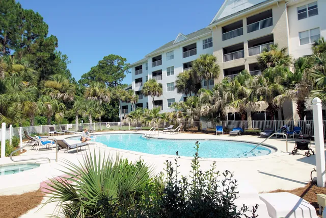 a view of a swimming pool with a yard