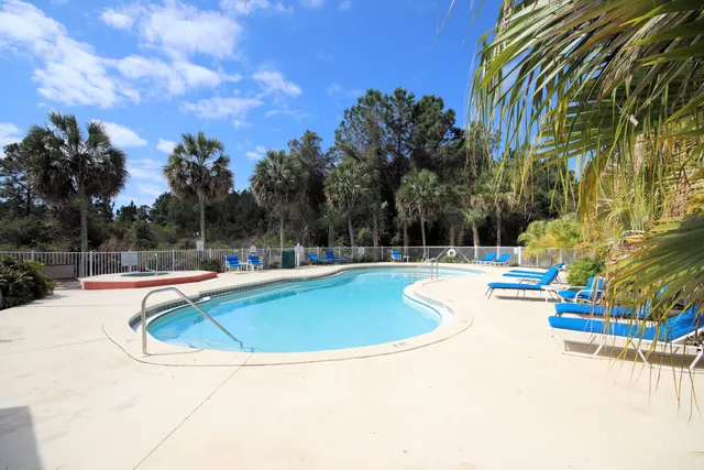 a view of a dinning table and chairs in patio