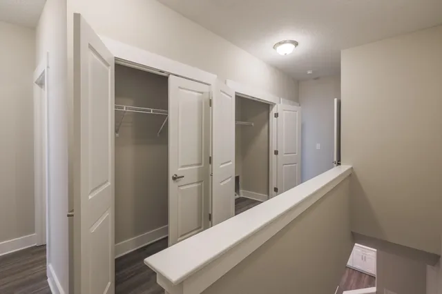 a view of hallway with cabinets