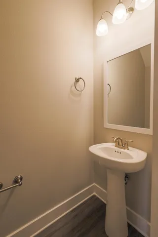 a bathroom with a sink a mirror and a toilet