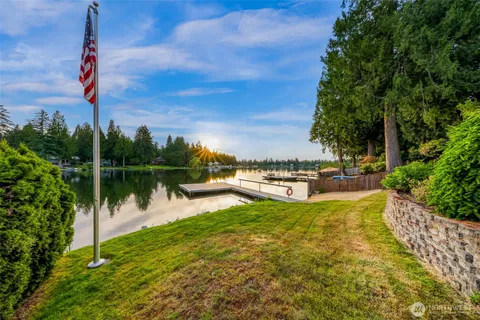 a view of a lake with sitting area