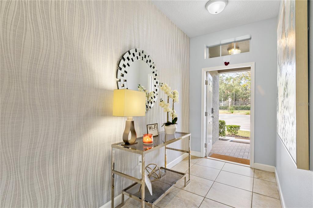 9006 Majesty Palm Road Kissimmee, FL 34747 - Photo 6 of 56 a living room with furniture and a window