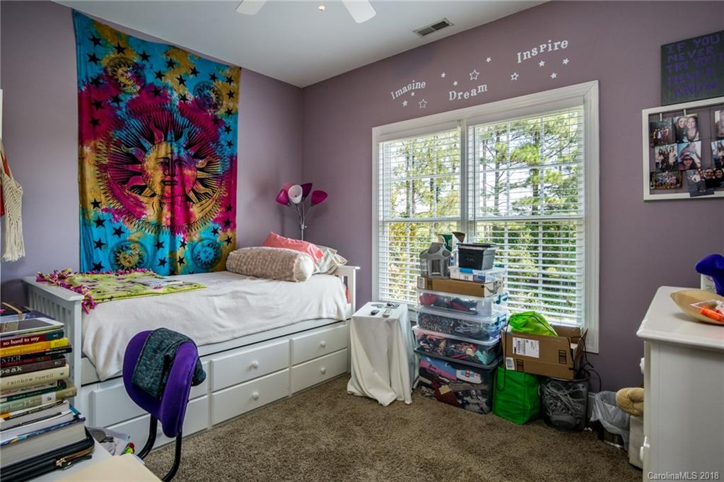 3526 Sincerity Road, Unit 13 Monroe, NC 28110 - Photo 11 of 20 a bedroom with a bed and a workspace