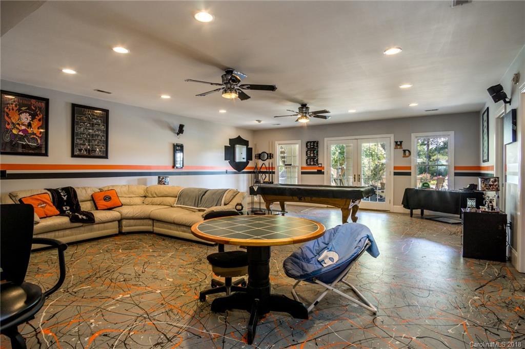 3526 Sincerity Road, Unit 13 Monroe, NC 28110 - Photo 12 of 20 a living room with furniture a rug and a chandelier