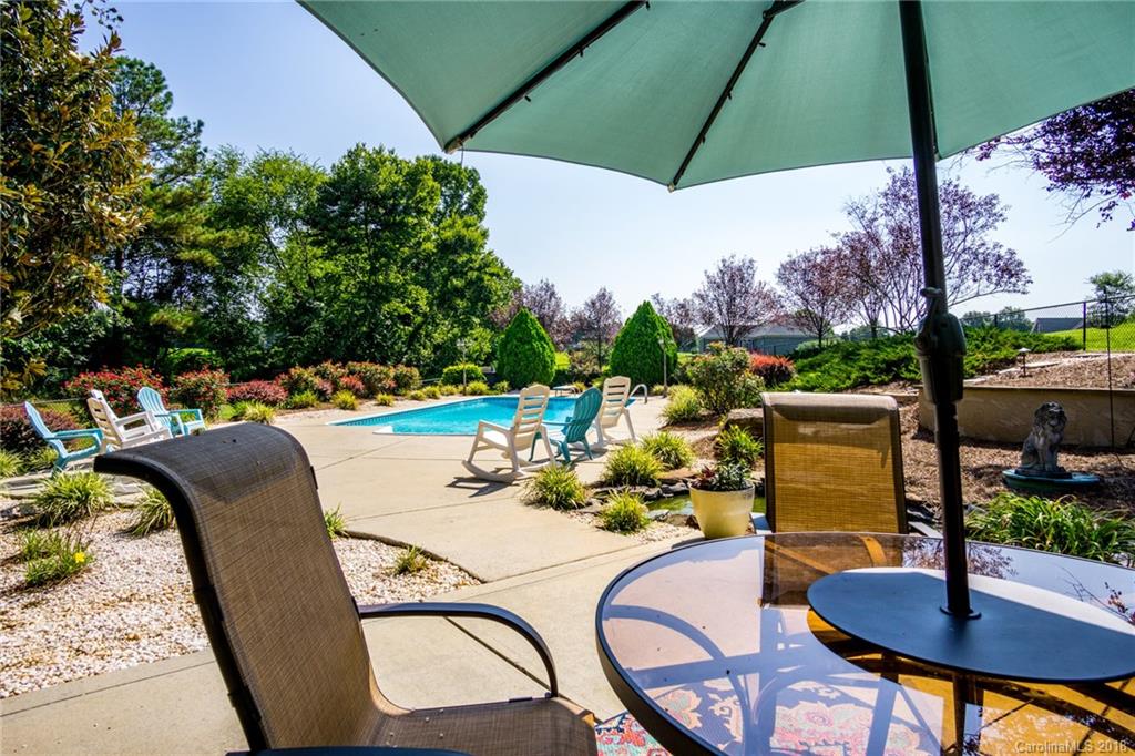 3526 Sincerity Road, Unit 13 Monroe, NC 28110 - Photo 17 of 20 a view of a swimming pool with a patio