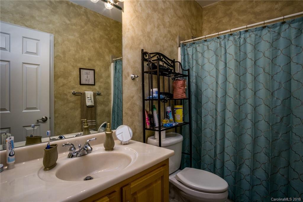 3526 Sincerity Road, Unit 13 Monroe, NC 28110 - Photo 8 of 20 a bathroom with a sink a toilet and shower