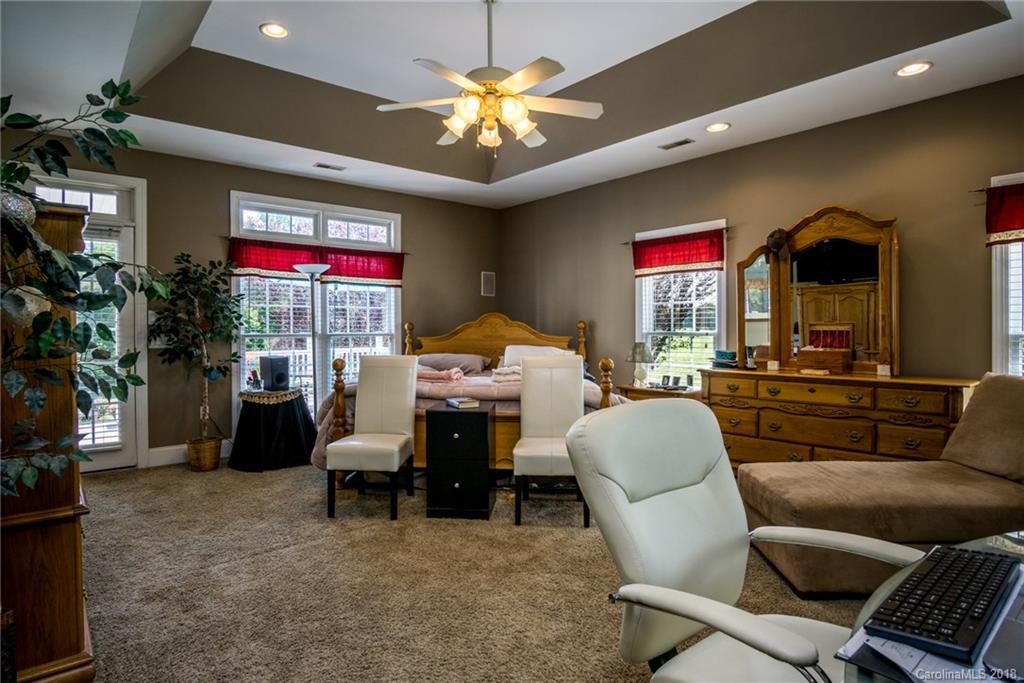 3526 Sincerity Road, Unit 13 Monroe, NC 28110 - Photo 9 of 20 a living room with furniture and a potted plant