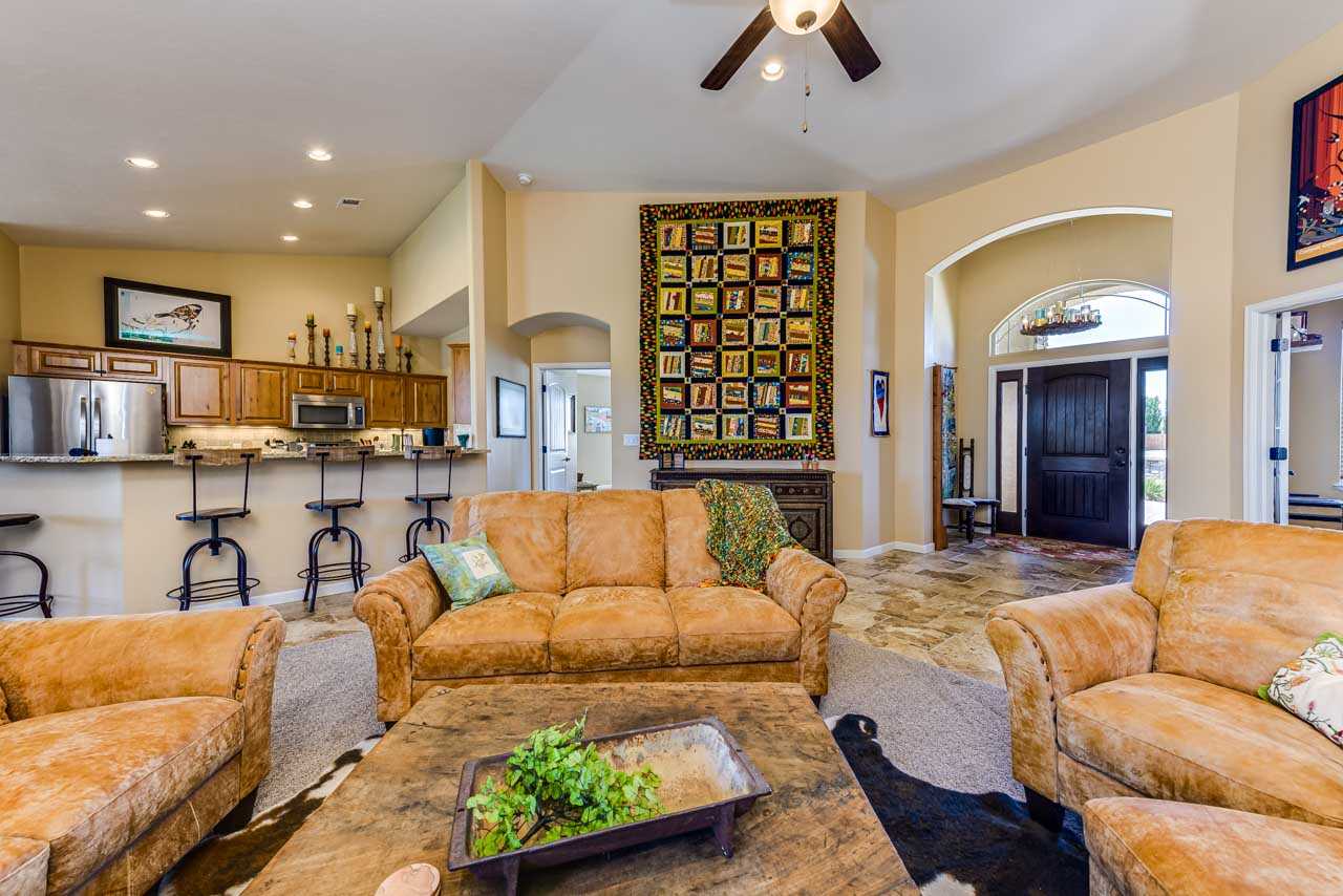 2530 Riata Ranch Court Grand Junction, CO 81505 - Photo 11 of 41 a living room with furniture and a flat screen tv